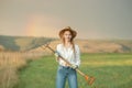 Country woman in field with pitchfork. Harvest festival Royalty Free Stock Photo