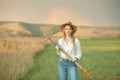 Country woman in field with pitchfork. Harvest festival Royalty Free Stock Photo