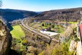 Countryside aerial view with railroad, mountains, houses and green field Royalty Free Stock Photo