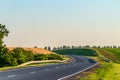 Countryside asphalt road with marking and guard rails Royalty Free Stock Photo