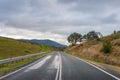 Countryside asphalt road with yellow road signs Royalty Free Stock Photo