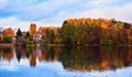 Countryside autumn house at the bank of a lake in Trakai Royalty Free Stock Photo