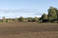 Countryside fall landscape with blue sky, puffy white clouds and autumn colors Royalty Free Stock Photo