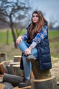 Countryside girl in jeans and plaid shirt Royalty Free Stock Photo