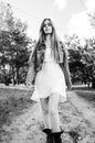 Countryside girl walking on the wood on the sand road Royalty Free Stock Photo