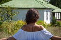 Countryside girl woman in summer Ukrainian village, back view. Summer vacation Royalty Free Stock Photo