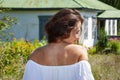 Countryside happy girl woman in summer Ukrainian village, back view. Summer vacation Royalty Free Stock Photo