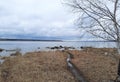 The countryside, the horizon, the lake and the sky in the clouds. A path leading across the shoreline to the lake. Royalty Free Stock Photo