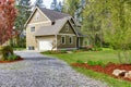 Countryside house exterior. View of entrance and gravel driveway Royalty Free Stock Photo