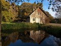 Countryside house by a small lake Royalty Free Stock Photo