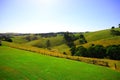 Countryside landscape with blue sky and mountains Royalty Free Stock Photo