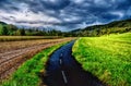 Countryside landscape with solitary dry tree at evening dusk Royalty Free Stock Photo