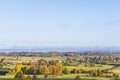 Countryside landscape view with farms and fields at autumn Royalty Free Stock Photo