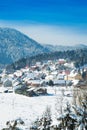 Countryside landscape in winter in Croatia, panoramic view of town of Lokve under snow in Gorski kotar Royalty Free Stock Photo