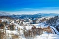 Countryside landscape in winter in Croatia, panoramic view of town of Lokve under snow in Gorski kotar Royalty Free Stock Photo