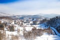 Countryside landscape in winter in Croatia, panoramic view of town of Lokve under snow in Gorski kotar Royalty Free Stock Photo