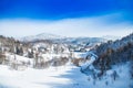 Countryside landscape in winter in Croatia, panoramic view of town of Lokve under snow in Gorski kotar Royalty Free Stock Photo