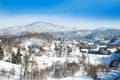 Countryside landscape in winter in Croatia, panoramic view of town of Lokve under snow in Gorski kotar Royalty Free Stock Photo