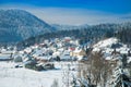 Countryside landscape in winter in Croatia, panoramic view of town of Lokve under snow in Gorski kotar Royalty Free Stock Photo
