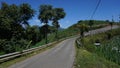 the countryside with mountains in the background, blue sky, sunny weather