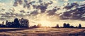 Countryside panorama at sunset. Golden wheat field Royalty Free Stock Photo