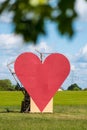 Countryside passion concept, big red heart in the middle of the fields Royalty Free Stock Photo