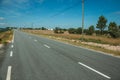 Countryside paved road and electric poles