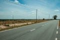 Countryside paved road and electric poles