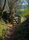 Countryside public footpath with open gate in spring Royalty Free Stock Photo