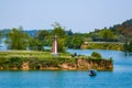 Countryside riverside scenery and sailing lighthouse