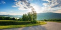 countryside road in mountains on a sunny day Royalty Free Stock Photo