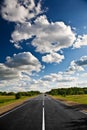 Countryside road under clouds Royalty Free Stock Photo