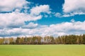 Countryside Rural Field Or Meadow Landscape With Green Grass On Foreground And Forest On Background Under Scenic Spring Royalty Free Stock Photo