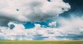 Countryside Rural Field Meadow Landscape In Sunny Rainy Spring Day. Scenic Sky With Rain Clouds On Horizon. Agricultural Royalty Free Stock Photo