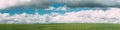 Countryside Rural Green Wheat Field Meadow Landscape In Summer Sunny Day. Scenic Sky With Clouds On Horizon. Panorama Royalty Free Stock Photo