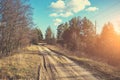 Country dirt road in evening at sunset light Royalty Free Stock Photo