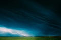 Countryside Rural Wheat Field Meadow Landscape In Summer Rainy Day. Scenic Sky With Rain Clouds On Horizon. Royalty Free Stock Photo