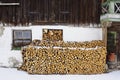 Winter, snowy stack of firewood in front of an old farm, Bavaria, Germany Royalty Free Stock Photo