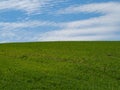 Countryside spring landscape of plowed fields. Green grass and blue sky. Ponidzie. Poland Royalty Free Stock Photo