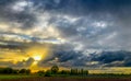 Countryside sunrise over the fields showing the dramatic colors in the sky. Royalty Free Stock Photo