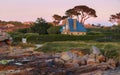 Countryside sunset landscape with authentic old house on the Pink Granite Coast. Ploumanac`h, Perros-Guirec, Brittany, France.