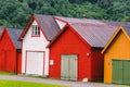 Countryside view of colored wooden buildings. Boathouses in Norway. Scandinavian traditional boat houses. multi-colored garage Royalty Free Stock Photo