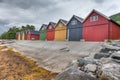 Countryside view of colored wooden buildings. Boathouses in Norway. Scandinavian traditional boat houses. multi-colored garage Royalty Free Stock Photo