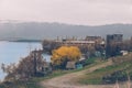 Countryside view to the lake shore with unfinished multy-story houses