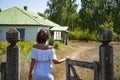 Countryside woman in summer go to village cottage house outdoor Royalty Free Stock Photo