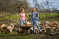 Women loading wood in the wheelbarrow