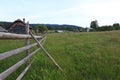 Countryside wood fence and meadow in Bucovina