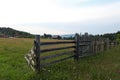 Countryside wood fence and meadow in Bucovina