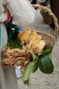 Countrywoman with Yellow Corns inside Wicker Basket