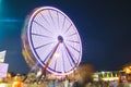 County Fair at night Ferris Wheel on the Midway Royalty Free Stock Photo